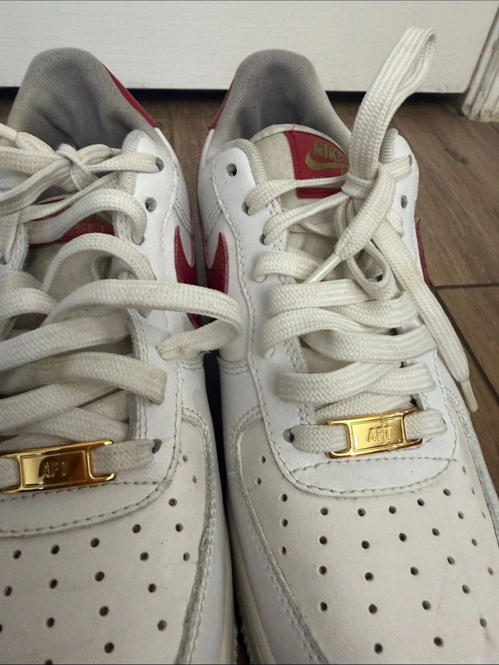Nike Air Force 1 '07 ESS White Sneakers with Red Swoosh